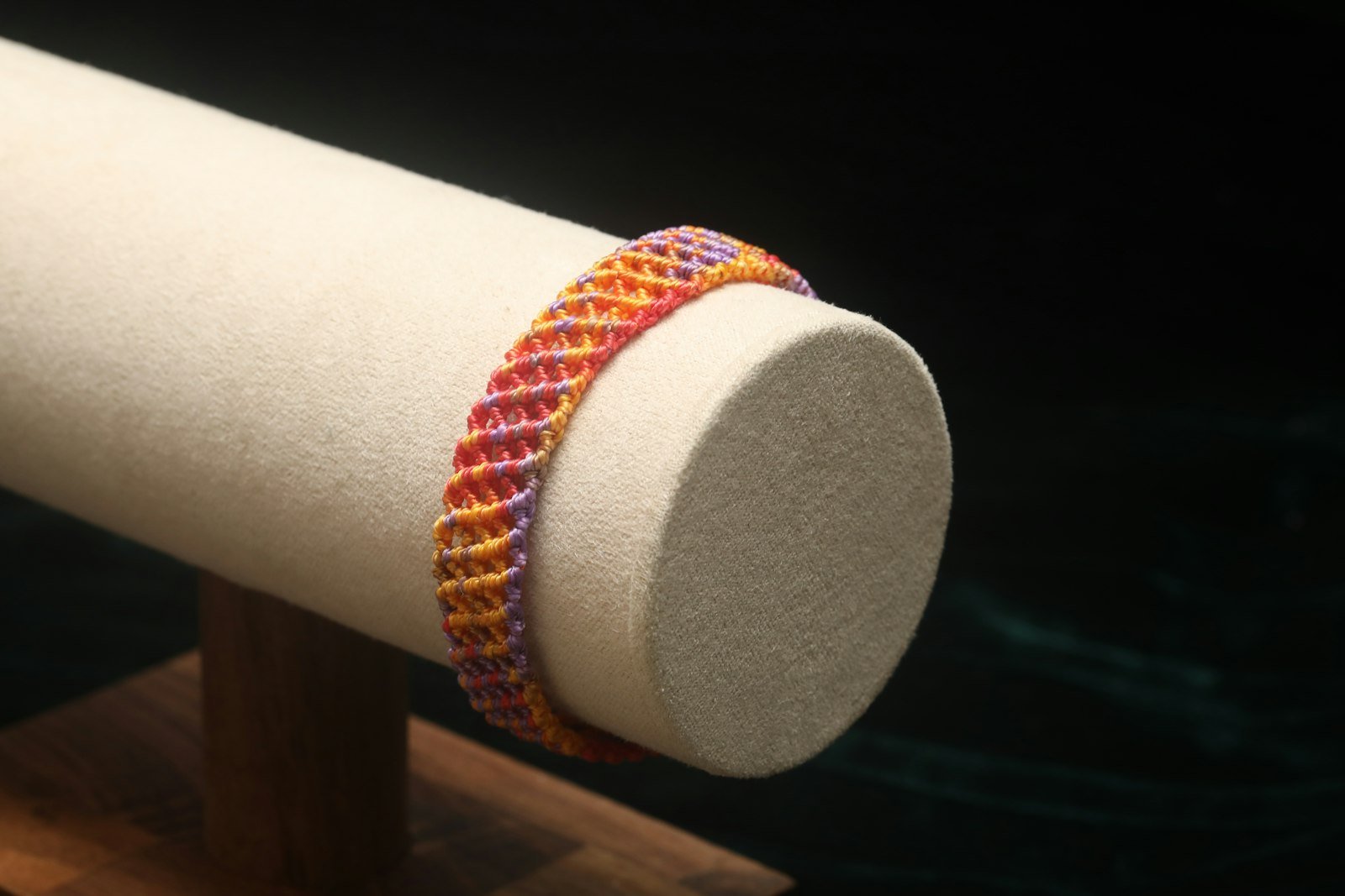 Handwoven bracelet on a display stand